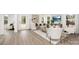 Bright living room featuring modern décor, neutral tones, and hardwood style floors at 9423 Weston Woods Ln, Charlotte, NC 28216