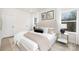 Comfortable main bedroom with a padded headboard, natural light, and stylish side tables at 9423 Weston Woods Ln, Charlotte, NC 28216