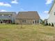View of backyard featuring house, small tree and neighboring houses at 9620 Fire Bellied Ct, Lancaster, SC 29720