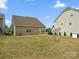 Home's backyard with a patio, small tree and a view of the side of the house at 9620 Fire Bellied Ct, Lancaster, SC 29720