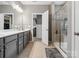 Bathroom featuring a double vanity with lots of counter space, and a glass-enclosed shower at 9620 Fire Bellied Ct, Lancaster, SC 29720