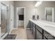 Bathroom featuring a large vanity with double sinks, and a glass-enclosed shower at 9620 Fire Bellied Ct, Lancaster, SC 29720