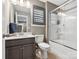 Well-lit bathroom featuring a vanity with sink and a shower with glass sliding doors at 9620 Fire Bellied Ct, Lancaster, SC 29720