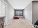 Bedroom showcasing a beanbag chair, carpeted floor, and window with natural light at 9620 Fire Bellied Ct, Lancaster, SC 29720