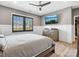 Serene bedroom featuring a large window, flatscreen TV, and a stylish dresser for storage and comfort at 9620 Fire Bellied Ct, Lancaster, SC 29720