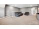 Spacious bonus room with carpet flooring, neutral paint, and comfortable seating at 9620 Fire Bellied Ct, Lancaster, SC 29720