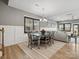 Open dining area adjacent to the living room, featuring wainscoting and plenty of natural light at 9620 Fire Bellied Ct, Lancaster, SC 29720