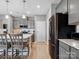 Bright kitchen with gray cabinets, stainless steel appliances, and a center island with seating at 9620 Fire Bellied Ct, Lancaster, SC 29720