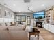 Relax in this living room featuring a fireplace, built-in shelves, and lots of comfy seating at 9620 Fire Bellied Ct, Lancaster, SC 29720
