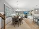 Open-concept living and dining area with hardwood floors and abundant natural light at 9620 Fire Bellied Ct, Lancaster, SC 29720