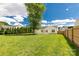 Expansive backyard featuring lush green grass, a large tree, and a charming wooden fence at 9916 Meadowmead Ct # 17, Charlotte, NC 28273