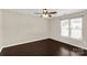 Cozy bedroom with hardwood floors, neutral paint and bright window at 9916 Meadowmead Ct # 17, Charlotte, NC 28273