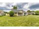 Well-maintained front yard showcasing a cozy home with green shutters and a classic design at 9916 Meadowmead Ct # 17, Charlotte, NC 28273