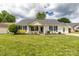Charming single-story home featuring green shutters, a cozy front porch, and a lush green lawn at 9916 Meadowmead Ct # 17, Charlotte, NC 28273