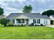 Charming single-story home with manicured lawn, inviting front porch, and tasteful landscaping at 9916 Meadowmead Ct # 17, Charlotte, NC 28273