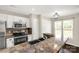 Kitchen featuring stainless appliances, granite countertops, and recessed lighting at 9916 Meadowmead Ct # 17, Charlotte, NC 28273