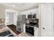 Modern kitchen featuring stainless appliances and ample storage space at 9916 Meadowmead Ct # 17, Charlotte, NC 28273