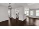An open-concept space with sleek dark flooring and modern lighting fixtures at 9916 Meadowmead Ct # 17, Charlotte, NC 28273