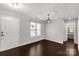 The living room is spacious, with dark floors, neutral walls, and ample natural light at 9916 Meadowmead Ct # 17, Charlotte, NC 28273