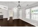 Living room is spacious and features a corner fireplace and a door leading to the outdoors at 9916 Meadowmead Ct # 17, Charlotte, NC 28273