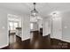 Inviting living room showcases dark wood floors and neutral paint, creating a modern aesthetic at 9916 Meadowmead Ct # 17, Charlotte, NC 28273
