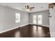 This main bedroom features a ceiling fan and access to the backyard via a glass door at 9916 Meadowmead Ct # 17, Charlotte, NC 28273