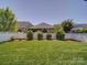 Spacious backyard featuring well-maintained lawn with a white picket fence at 1020 Equipoise Dr, Indian Trail, NC 28079