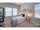 This bedroom features neutral walls, bright natural light, and modern decorations at 1020 Equipoise Dr, Indian Trail, NC 28079