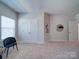 A bedroom with soft carpet, ample space, and multiple doors and mirrors at 1020 Equipoise Dr, Indian Trail, NC 28079