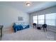 Bedroom featuring a cozy daybed, bright windows, and a relaxing seating area at 1020 Equipoise Dr, Indian Trail, NC 28079