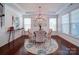 Well-lit dining room featuring hardwood floors, large windows, and modern decor at 1020 Equipoise Dr, Indian Trail, NC 28079
