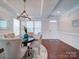 Elegant dining room with a round table, chandelier, and hardwood floors at 1020 Equipoise Dr, Indian Trail, NC 28079