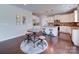 Eat-in kitchen featuring a round table, bar stools, and modern light fixtures at 1020 Equipoise Dr, Indian Trail, NC 28079