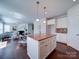 Open-concept kitchen with island, granite countertops, and view of the living room at 1020 Equipoise Dr, Indian Trail, NC 28079