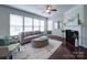Bright living room with a fireplace, large windows, and comfortable seating at 1020 Equipoise Dr, Indian Trail, NC 28079