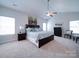 Spacious primary bedroom with a ceiling fan, and neutral color palette at 1020 Equipoise Dr, Indian Trail, NC 28079