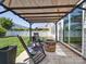 Cozy patio with a stone fire pit, rocking chairs, and a covered pergola at 1020 Equipoise Dr, Indian Trail, NC 28079