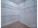 A well-organized walk-in closet featuring multiple shelves for efficient storage at 1020 Equipoise Dr, Indian Trail, NC 28079