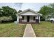 Charming home featuring a covered front porch and a well-maintained lawn, perfect for outdoor relaxation and curb appeal at 1025 Martin Luther King Jr Dr, Albemarle, NC 28001