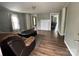 Inviting living room featuring a faux fireplace and wood flooring, with great natural light at 1025 Martin Luther King Jr Dr, Albemarle, NC 28001