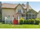 The home's backyard includes a spacious deck, screened in porch, and lush landscaping at 10316 Willingham Rd, Huntersville, NC 28078