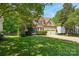 Charming two-story home with a brick facade, well-maintained lawn, and a two-car garage in a landscaped neighborhood at 10316 Willingham Rd, Huntersville, NC 28078