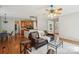 Comfortable living room with hardwood floors seamlessly transitioning to the kitchen and dining area at 10316 Willingham Rd, Huntersville, NC 28078