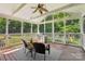 Relaxing screened porch featuring a grill and wooded views at 10316 Willingham Rd, Huntersville, NC 28078