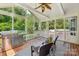 Inviting screened porch with a grill, ceiling fan, and outdoor seating at 10316 Willingham Rd, Huntersville, NC 28078