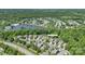 Lovely aerial view showcases 11008 Round Rock Dr and the community, near a tranquil lake and lush greenery at 11008 Round Rock Rd, Charlotte, NC 28277