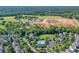 Construction site amongst residential homes and community pool and clubhouse at 11008 Round Rock Rd, Charlotte, NC 28277