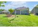 Beautiful backyard with lush lawn, mature landscaping, and a garden at 11008 Round Rock Rd, Charlotte, NC 28277