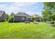 Spacious backyard featuring a well-manicured lawn and mature landscaping at 11008 Round Rock Rd, Charlotte, NC 28277
