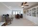 Bonus room featuring built in shelving and a ceiling fan at 11008 Round Rock Rd, Charlotte, NC 28277